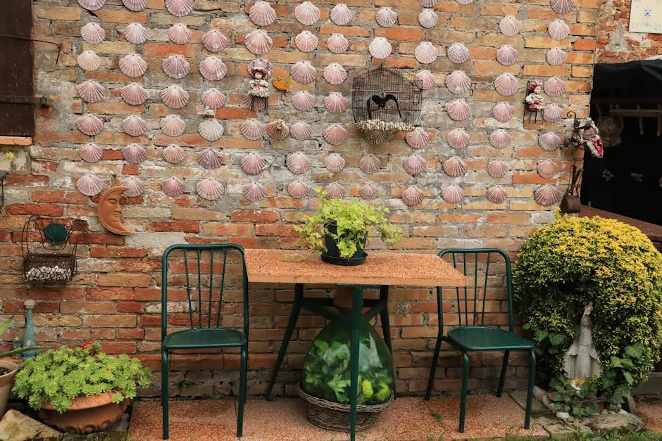 A cozy outdoor café setting features rustic brick interior design enhanced with shells and lush greenery.