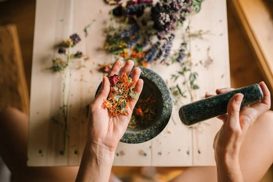 Hands grinding dried herbs with a mortar and pestle, perfect for holistic medicine and aromatherapy.