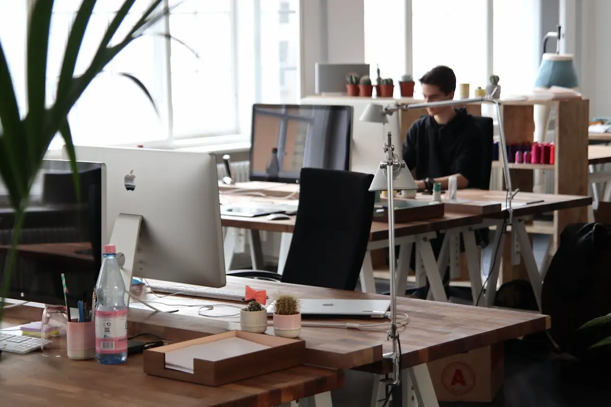 Open-plan office with modern decor and natural lighting, ideal for productivity.