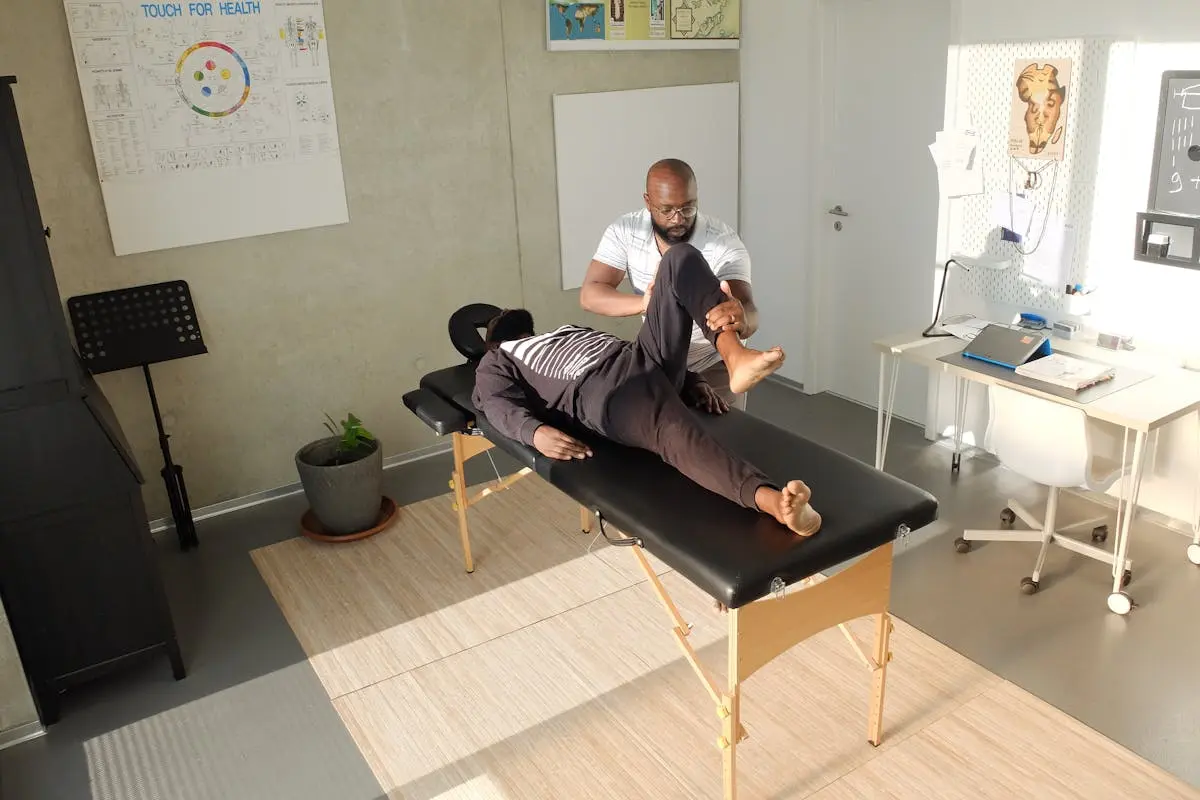 Therapist performing therapeutic massage in a clinic setting, emphasizing wellness and relaxation.