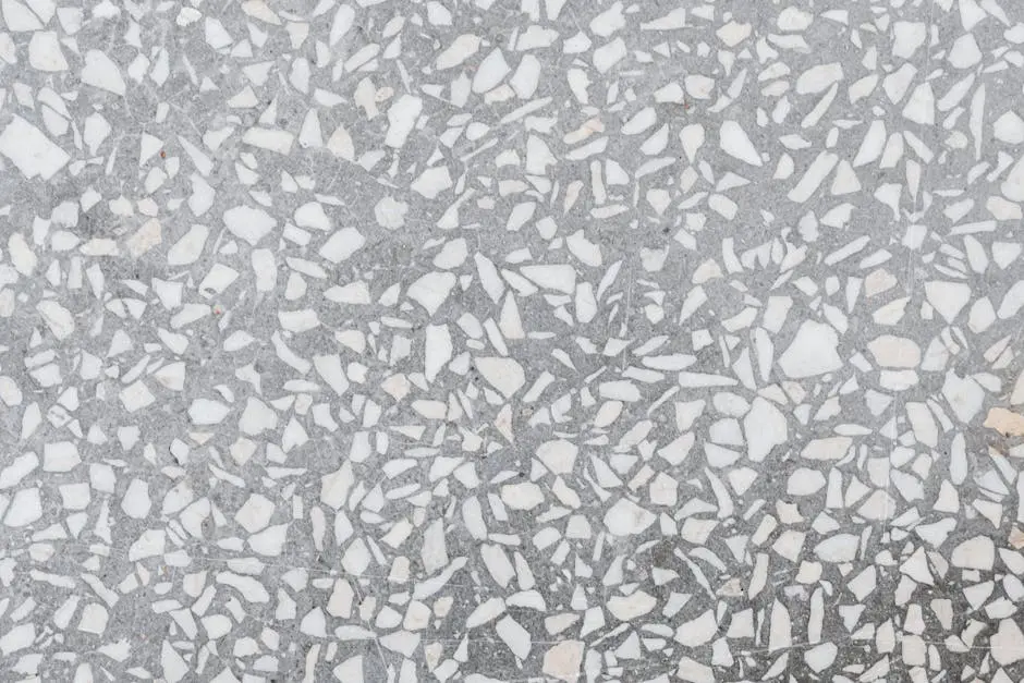 High-resolution image of a classic terrazzo stone texture with white and gray patterns.
