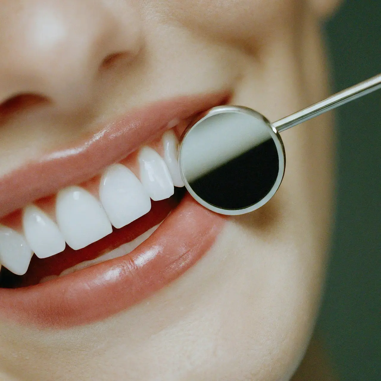 A bright smile with pristine, white teeth and dental tools. 35mm stock photo