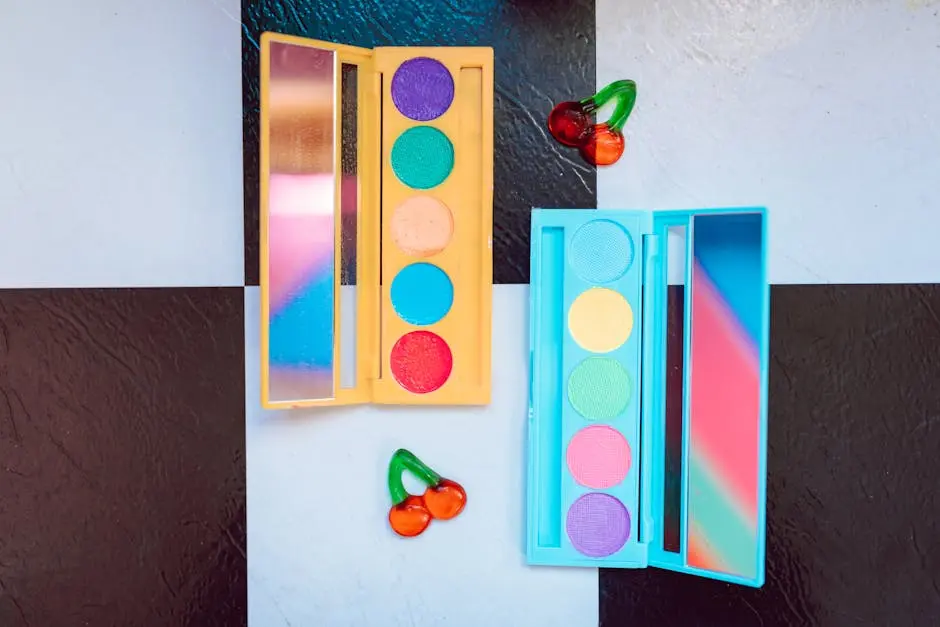 Bright and vibrant makeup palettes displayed on a stylish checkered surface with decorative cherries.