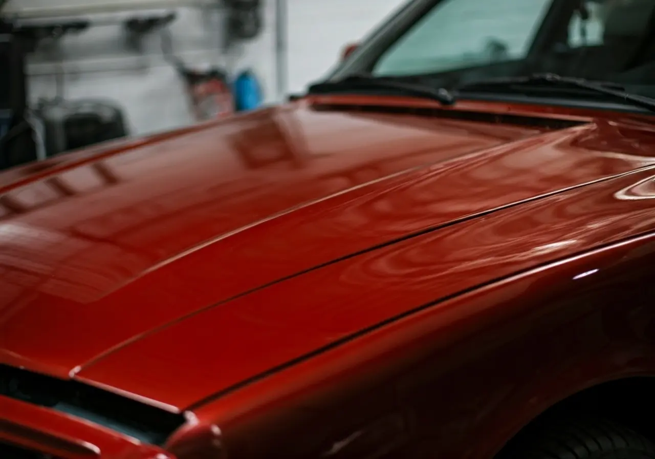 A shiny car hood reflecting light after waxing. 35mm stock photo