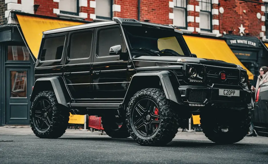 A powerful black Mercedes SUV parked in a vibrant urban area.