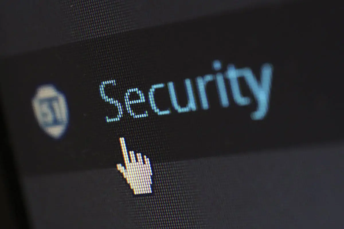 Close-up view of a mouse cursor over digital security text on display. Outsourced Finance and Accounting risks