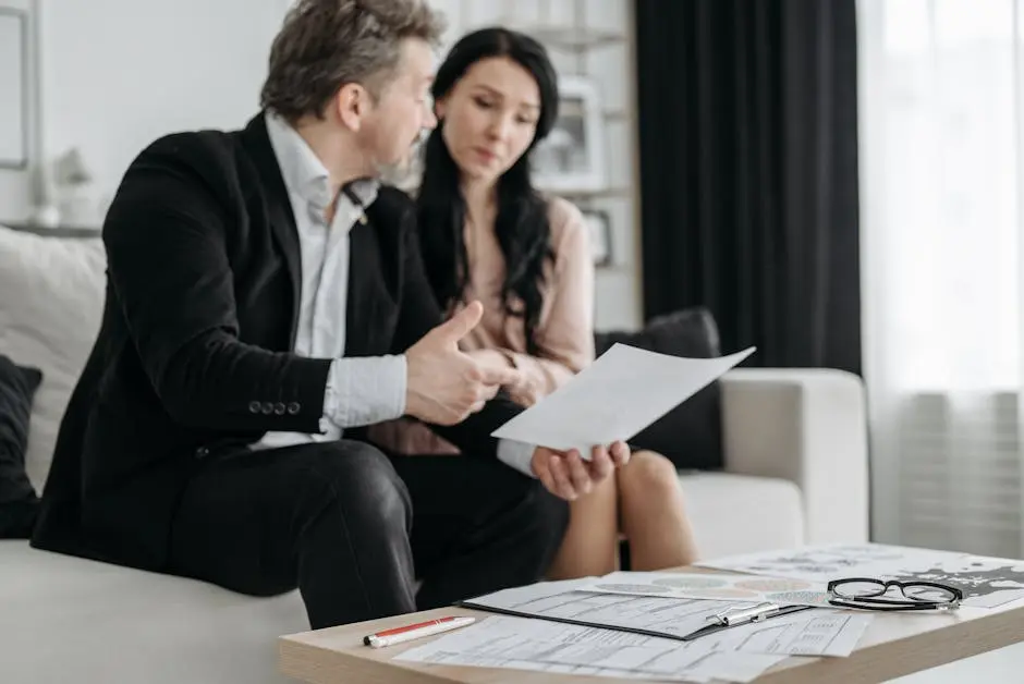 A couple discusses adoption paperwork in their living room, emphasizing their commitment and planning.