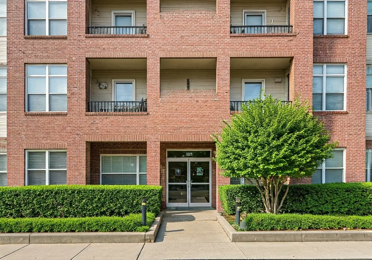 A cozy apartment building with welcoming entrance and lively greenery. 35mm stock photo