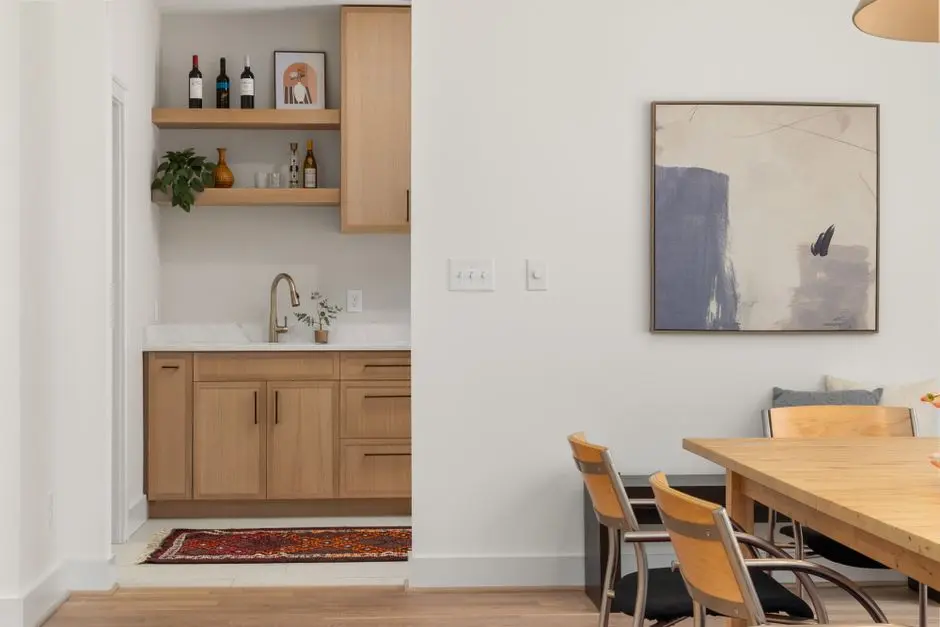 A modern dining area with sleek furniture and contemporary art decor.