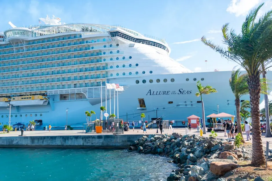 Discover the majestic Allure of the Seas docked in a vibrant tropical port.