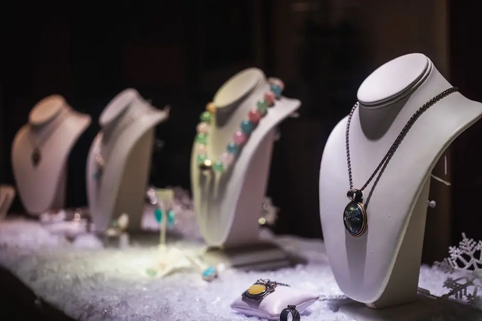 A refined display of luxurious necklaces on mannequins in a jewelry store.