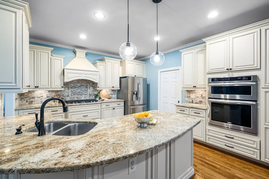 Stylish kitchen interior featuring marble countertops, stainless steel appliances, and custom cabinetry.