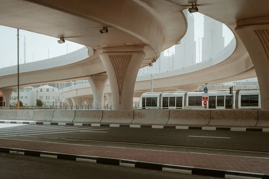 A modern overpass and metro in Dubai&rsquo;s urban landscape showcasing transportation infrastructure.