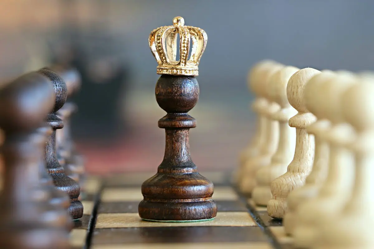 A brown pawn with a crown stands prominently on a chessboard, symbolizing strategic play.