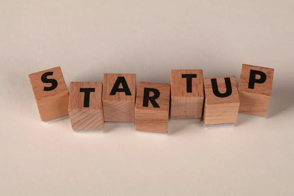 Wooden blocks forming the word &lsquo;STARTUP&rsquo; on a neutral background, symbolizing new business ventures.