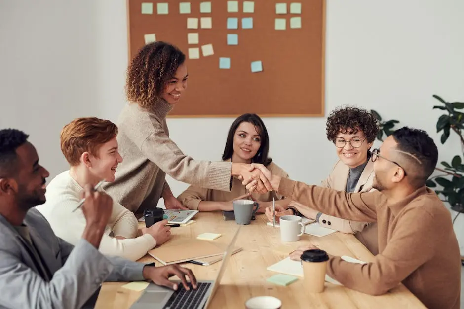 Diverse team collaborating in a meeting, showcasing teamwork and cooperation in a modern workplace. best outsourced cfo services | your neogig
