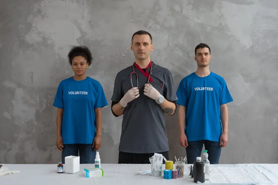 Doctor with volunteers in a clinic, showcasing teamwork and healthcare support.