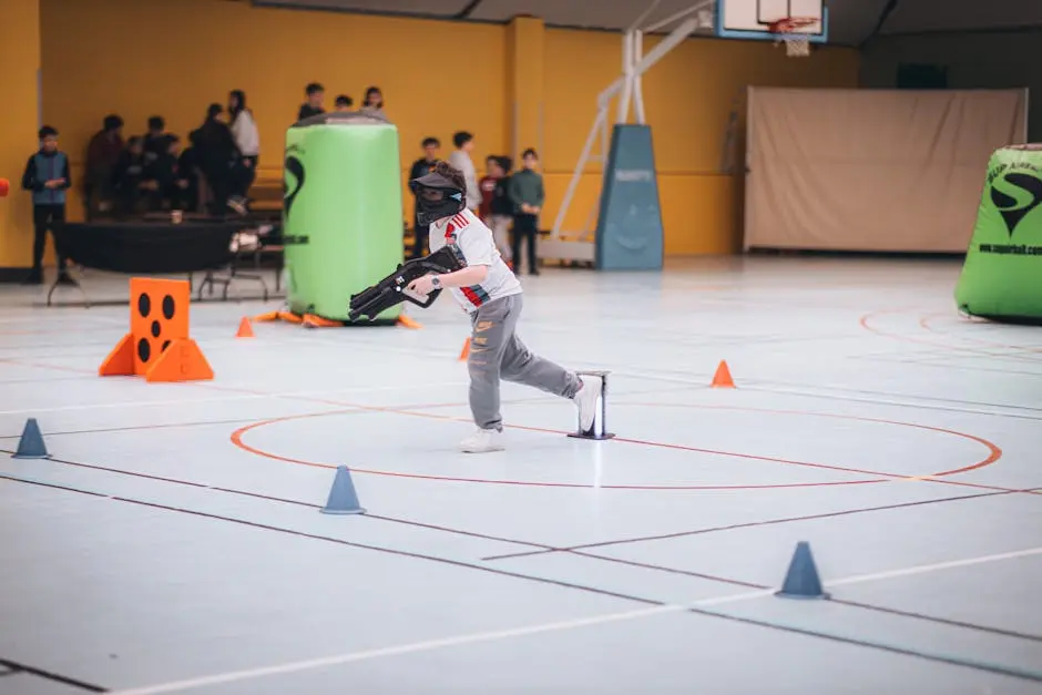 Kids playing an exciting game of laser tag indoors, focusing on teamwork and fun.
