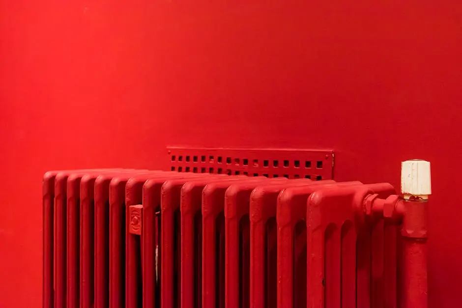 A vibrant red radiator against a matching wall captures minimalist and modern interior design.
