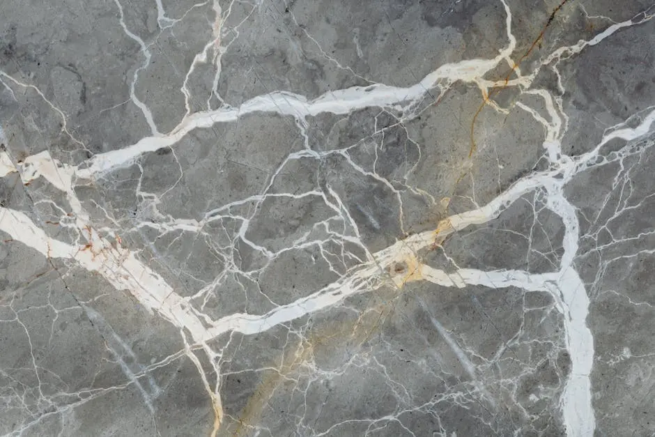 Detailed close-up of natural marble surface showcasing intricate vein patterns for design projects.