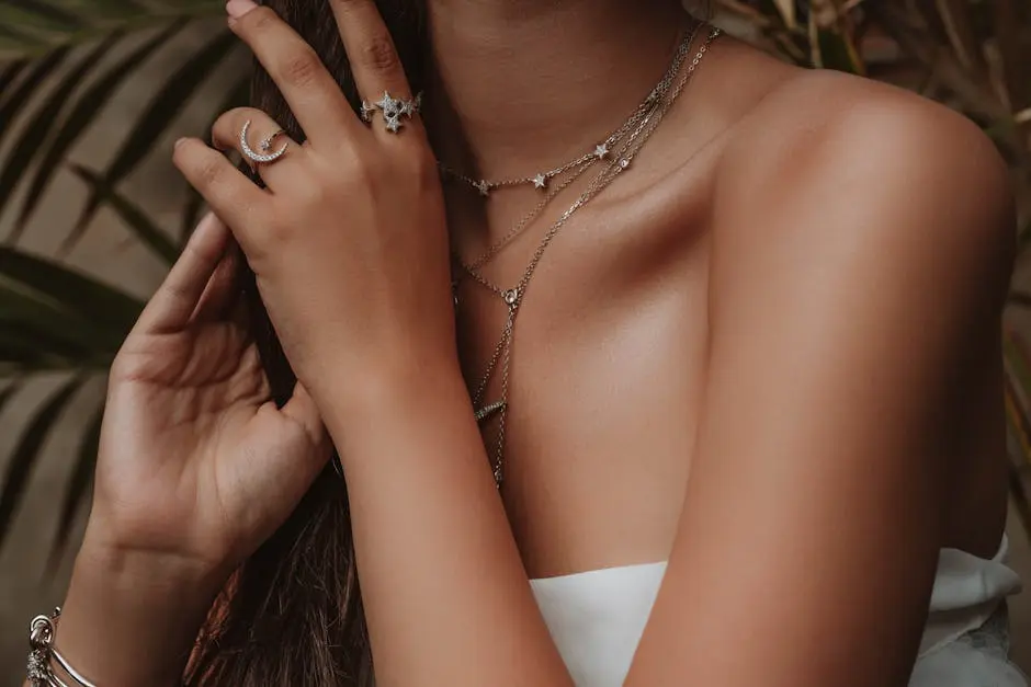 Close-up shot of a woman showcasing elegant jewelry, embodying modern fashion.