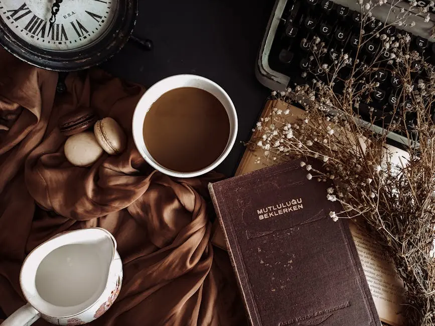 Aesthetic flat lay with coffee, book, typewriter, and rustic elements creating a vintage atmosphere.