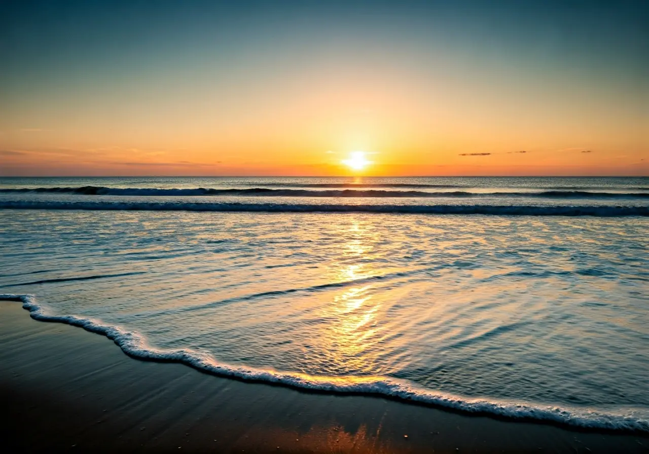 A serene beach at sunrise with gentle waves, symbolizing hope. 35mm stock photo