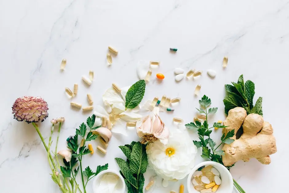 Natural herbs and pills arranged on a marble surface for a holistic healthcare theme.