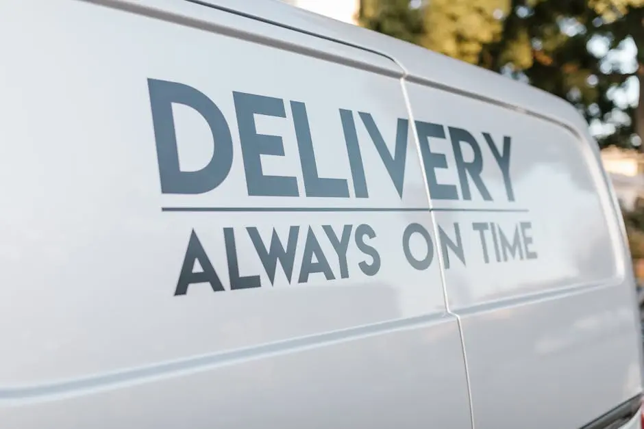 Close-up of delivery van with slogan &lsquo;Always On Time&rsquo; emphasizing timely service.