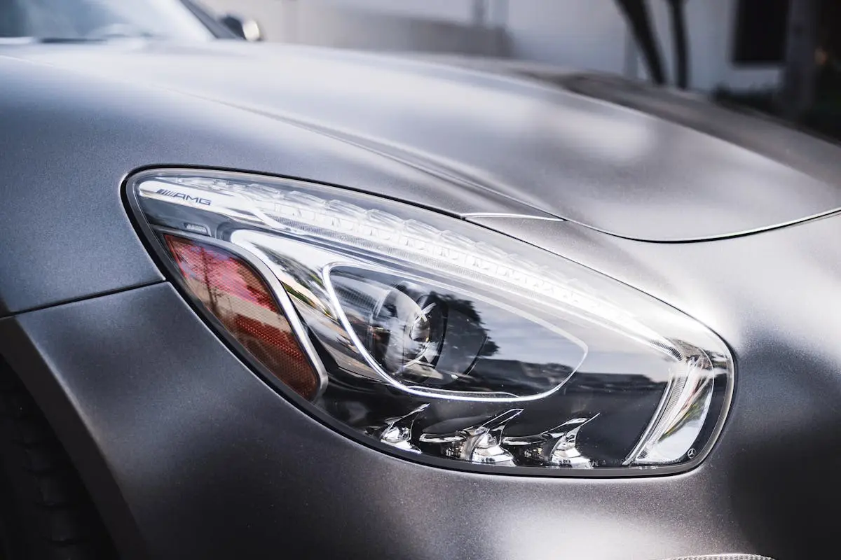 The sleek design of a luxury car’s headlight highlighting modern automotive engineering.