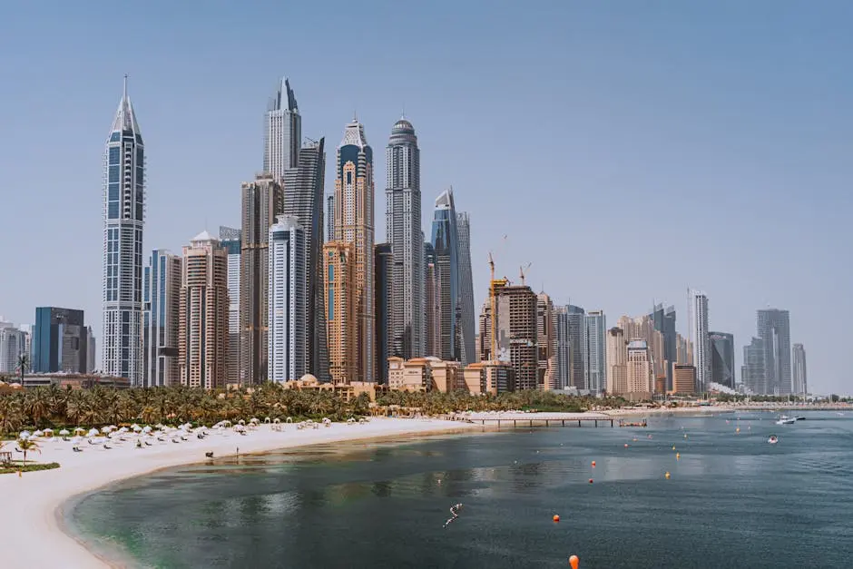 A breathtaking view of Dubai’s iconic skyline with modern skyscrapers against a clear blue sky.