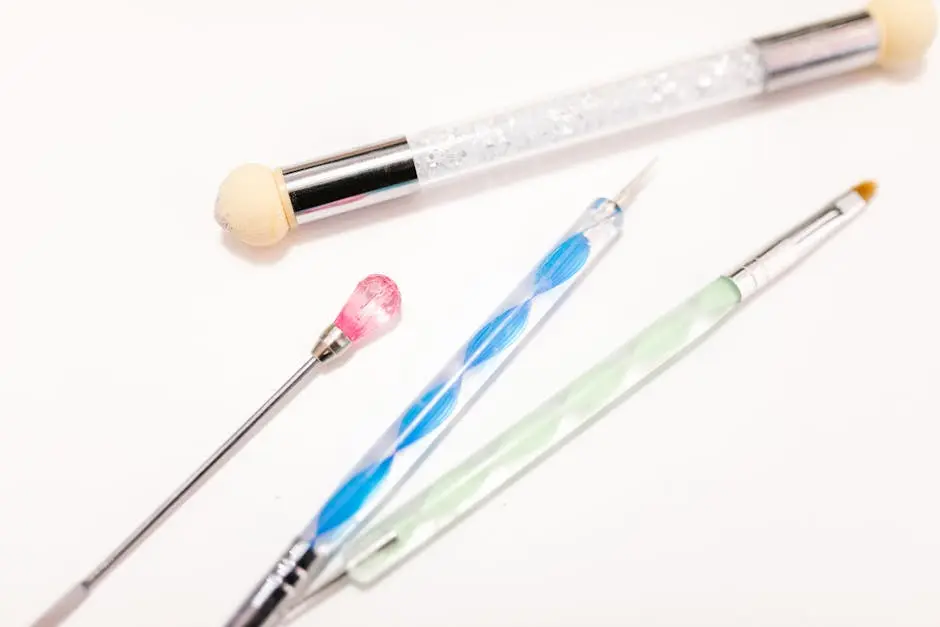 Detailed view of makeup and beauty tools including brushes on a white background.