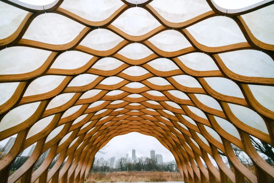 Captivating wooden architectural structure framing the Chicago skyline in a park setting.