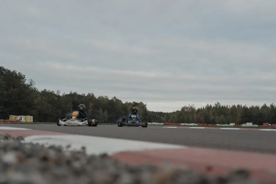 Thrilling karting competition as drivers race on an outdoor track amidst scenic surroundings.