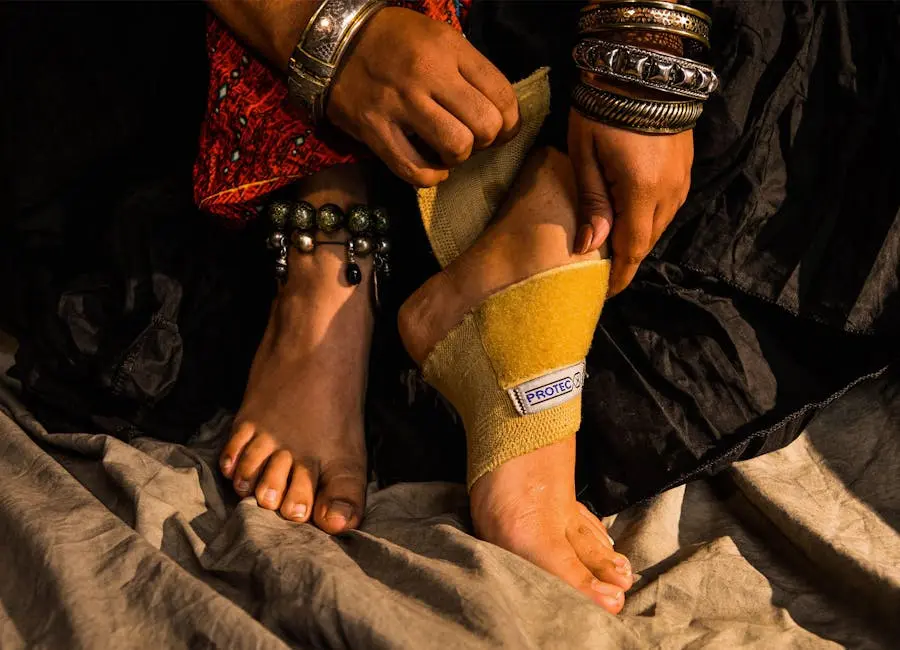 Woman adorned in jewelry adjusting foot brace for injury support.