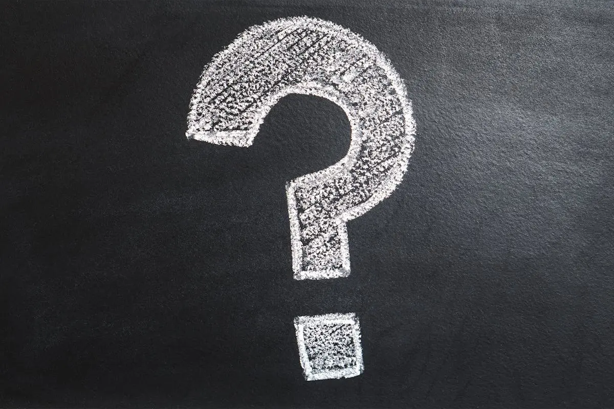 A conceptual image featuring a question mark drawn on a chalkboard, ideal for problem-solving contexts.