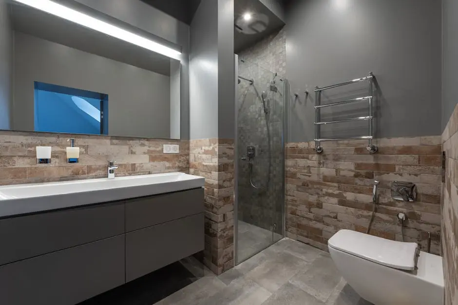 Sleek modern bathroom featuring a glass shower, floating vanity, and stylish decor.