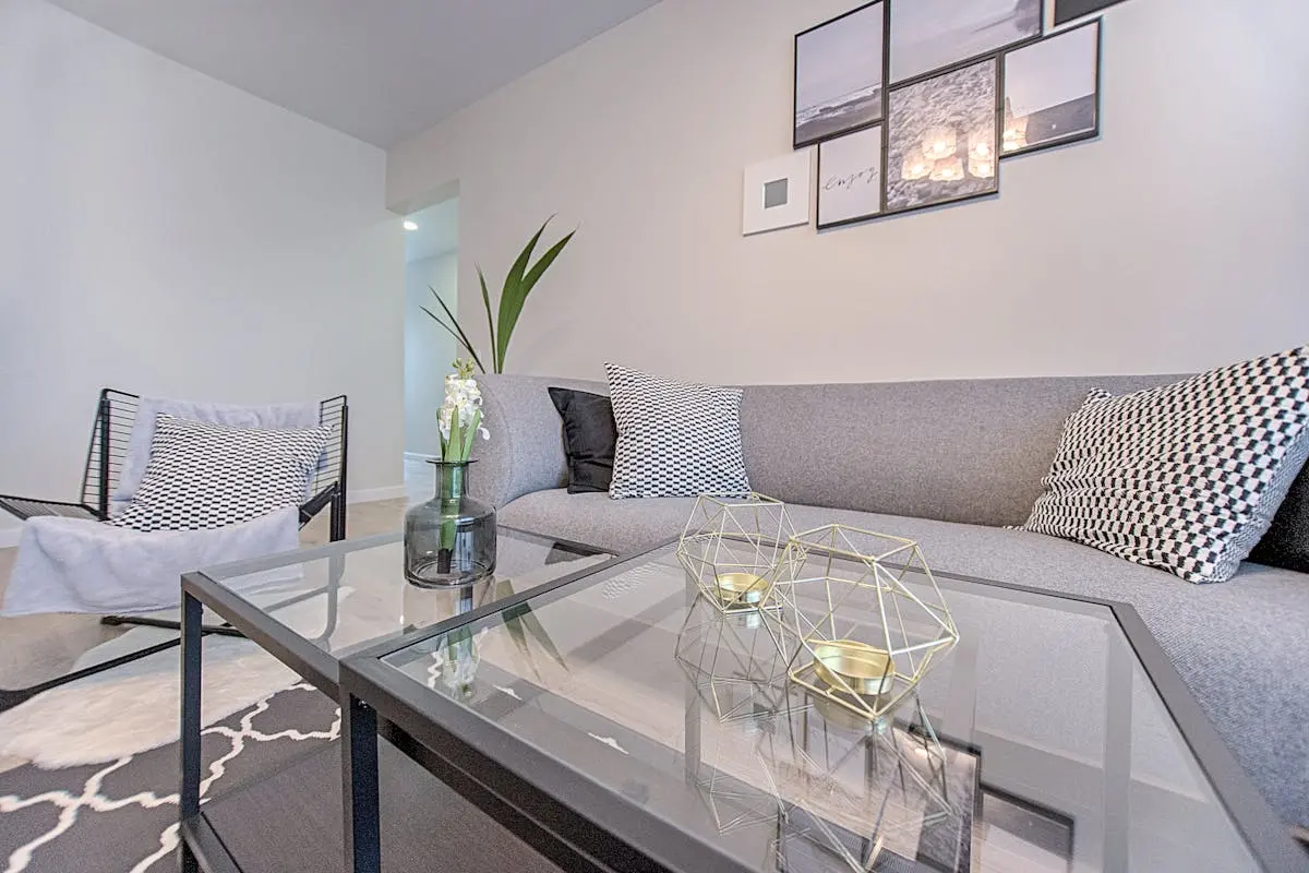 A stylish and comfortable living room featuring modern geometric decor and contemporary design elements.