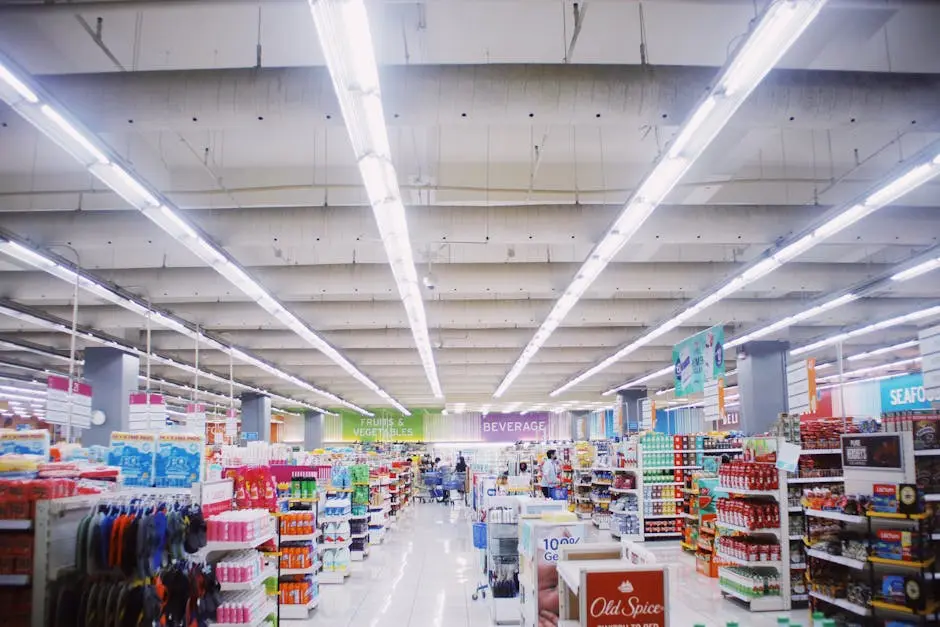 Explore a vibrant and spacious supermarket interior with diverse products and illuminated aisles.