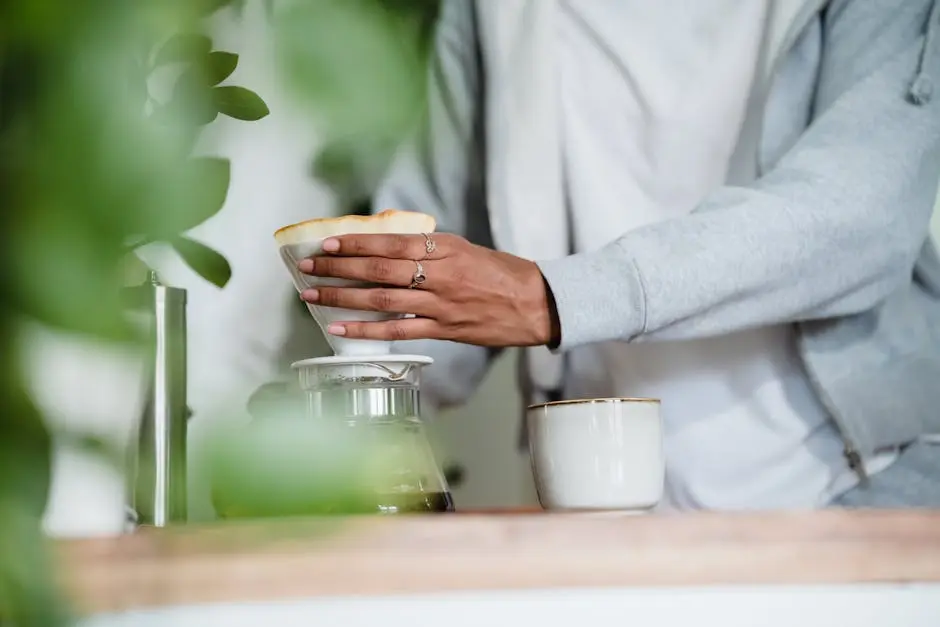 A person preparing a pour-over coffee in a cozy kitchen setting, focusing on the art of brewing.