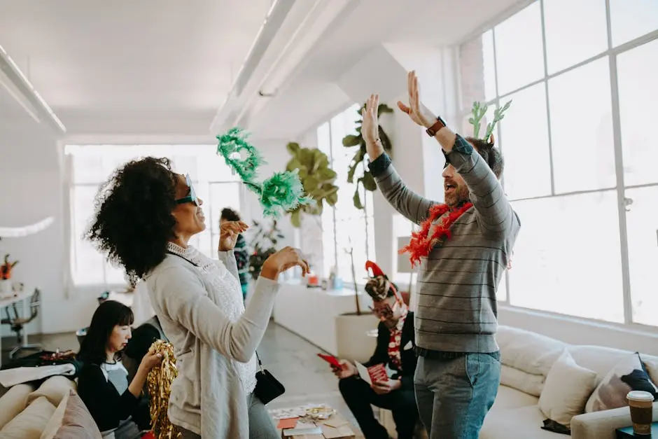 Group of playful adults enjoying a lively office holiday party indoors.