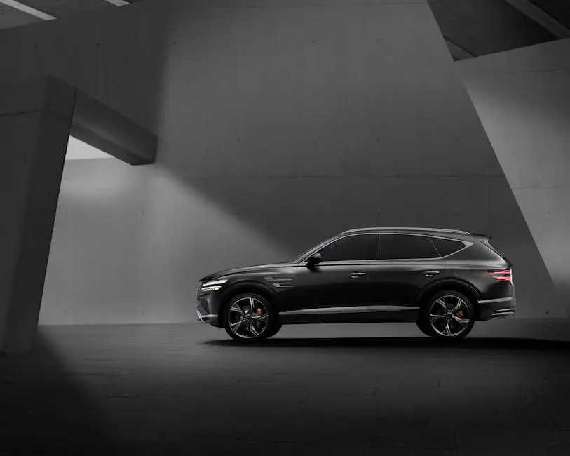 Elegant black SUV parked in a contemporary concrete structure, showcasing modern design elements.