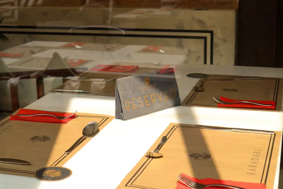 Elegant table setting with reserved sign at Baradari restaurant, Jaipur, India.