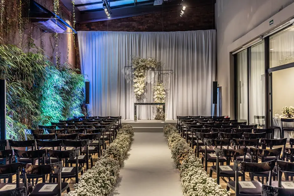 Beautifully decorated indoor wedding venue with elegant floral arrangements and seating.