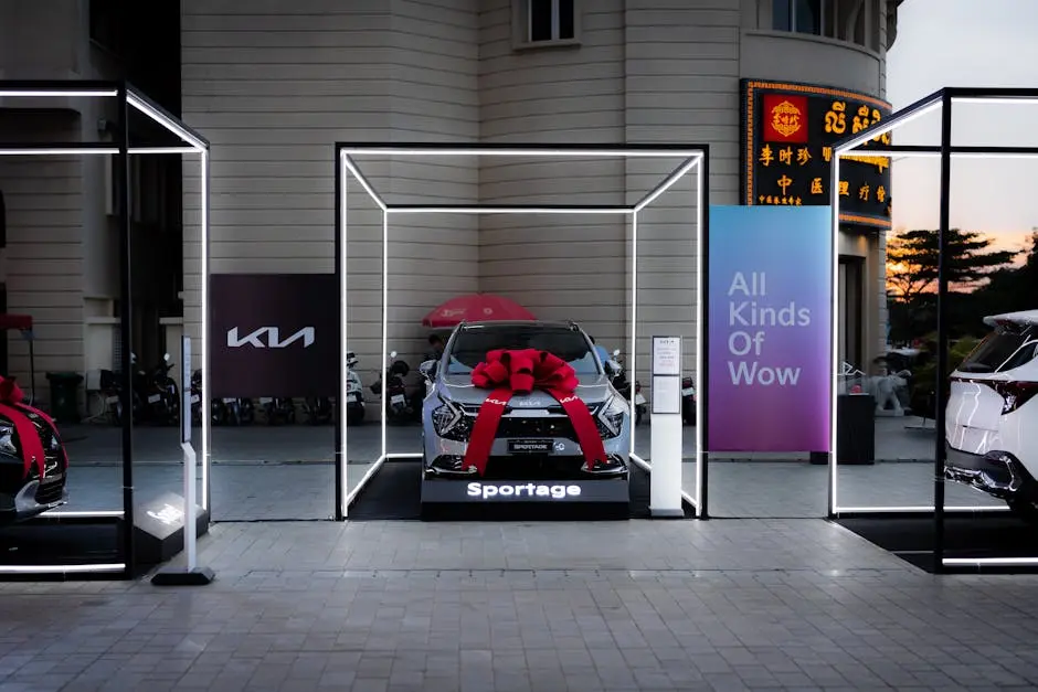 Kia Sportage showcased with neon lighting and a red bow, emphasizing modern automotive design.