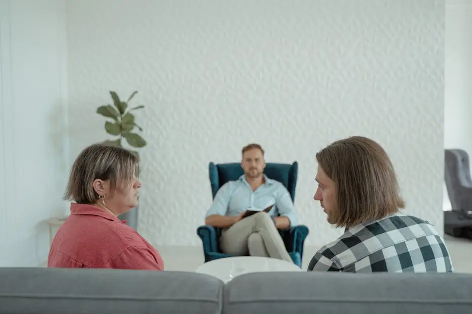 Image of a counseling session with a professional advisor, focusing on a couple&rsquo;s discussion.