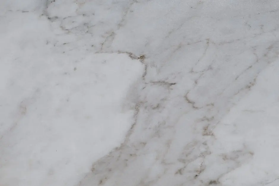 High-resolution image of a white marble surface showcasing natural texture and patterns.