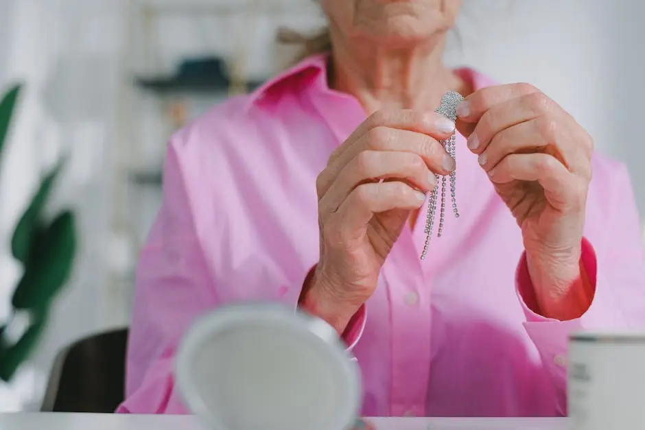 Senior woman holds sparkling jewelry, highlighting elegance in daily life.