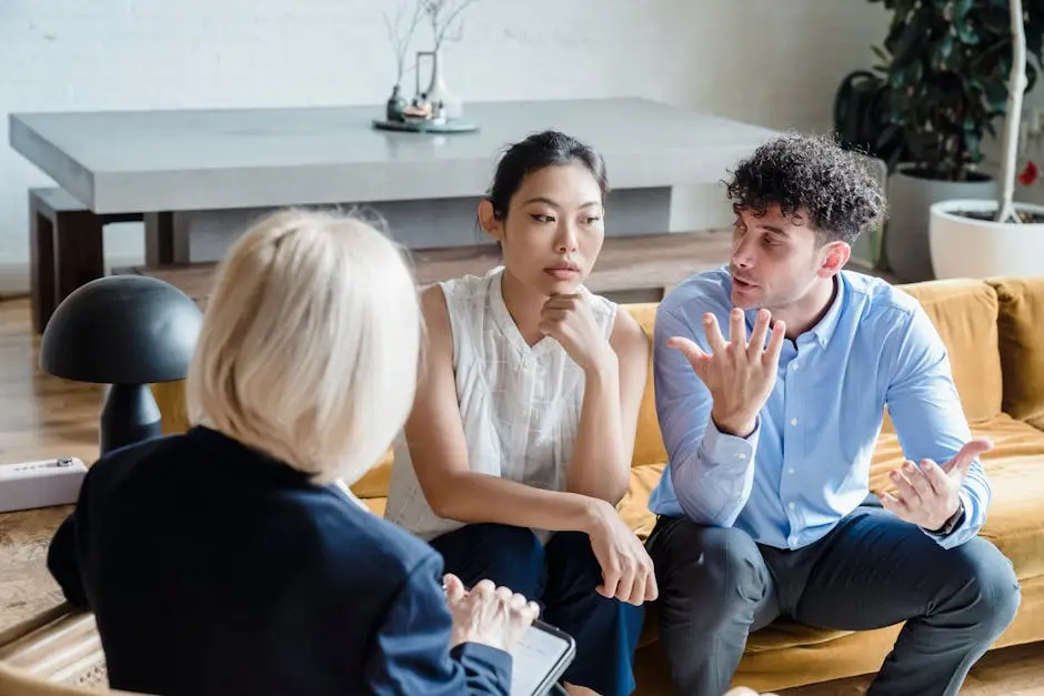 Couple discussing issues with a therapist during a counseling session.