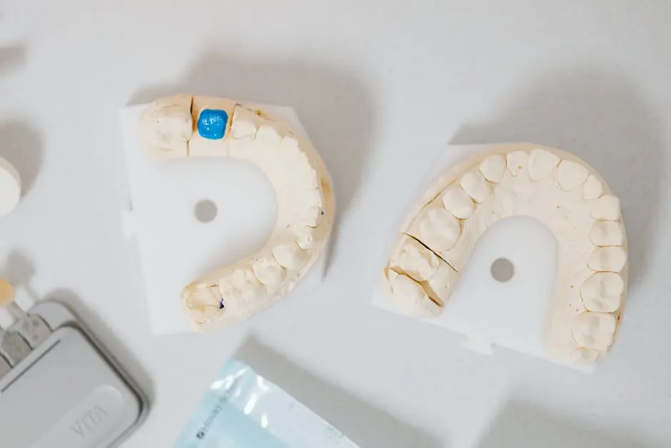 Close-up of dental molds on a white table, showcasing orthodontic details.